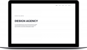 Laptop showing a homepage mockup design for a creative design agency
